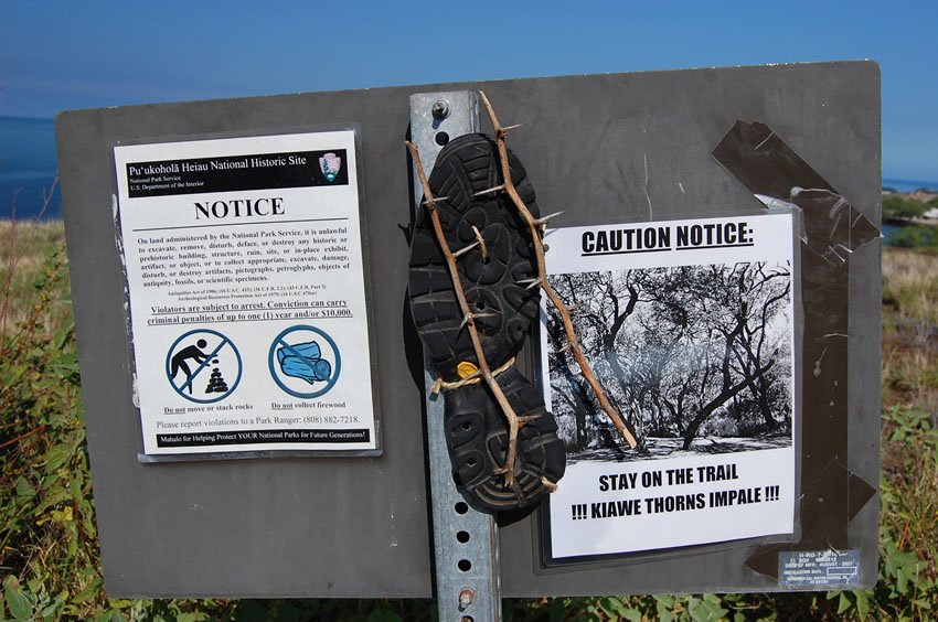 Stay on the trail warning sign