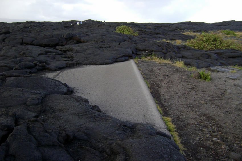 Road swallowed up by lava flow