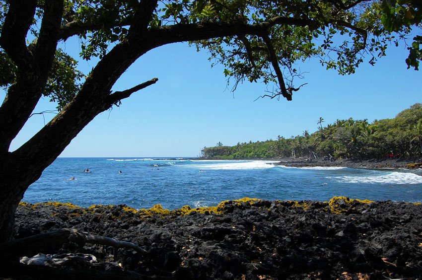 Black lava rocks and blue ocean