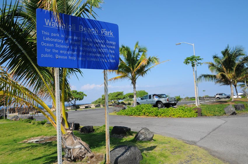 Beach park sign and parking lot