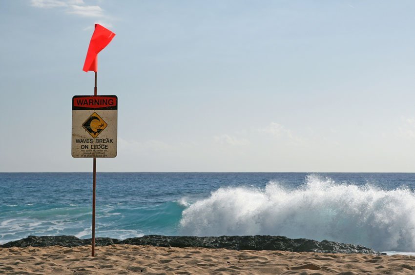 Waves break on ledge