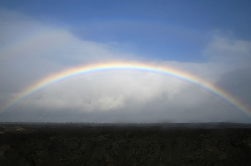 Rainbow in front of Maui's coastline