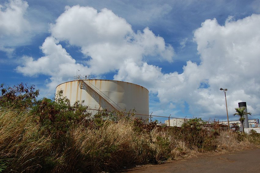 Beach is backed by gas tanks