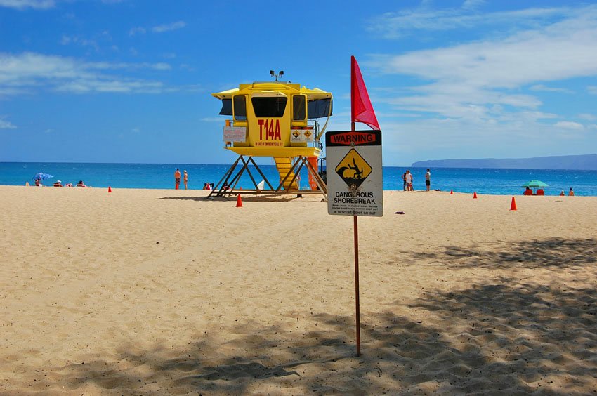 Warning sign in front of the lifeguard tower