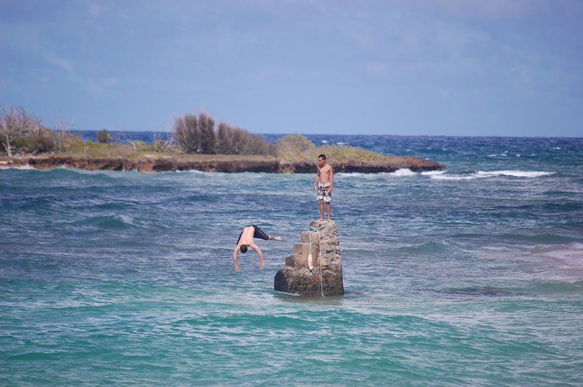 Kids jumping from a rock