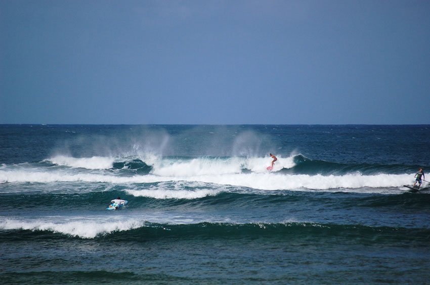 Surfing at Pua'ena Point